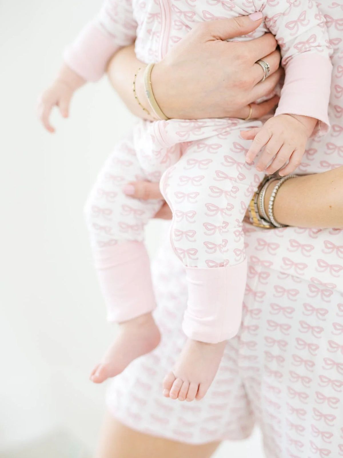 The Uptown Baby Bow Sleep Zip Romper