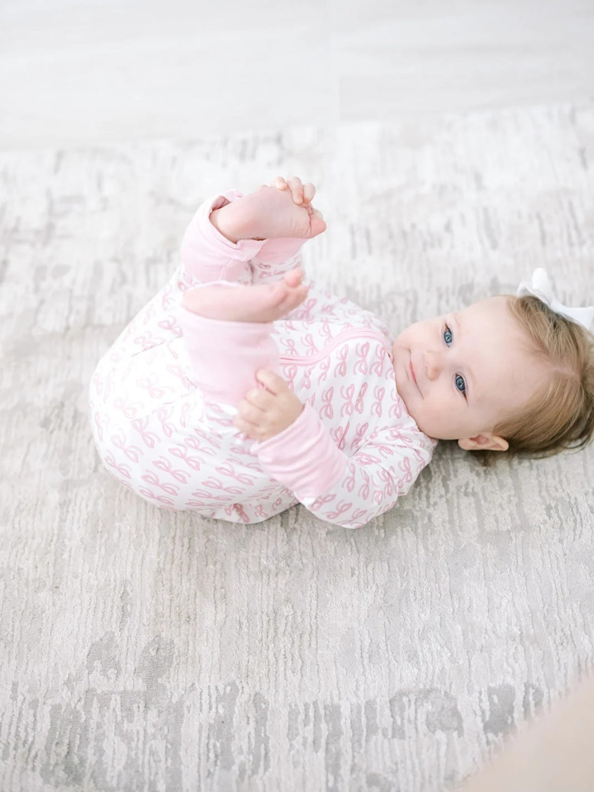 The Uptown Baby Bow Sleep Zip Romper