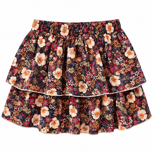 A tiered ruffle skirt with a dense floral pattern on a dark navy background, featuring cream, orange, and red flowers with green leaves.